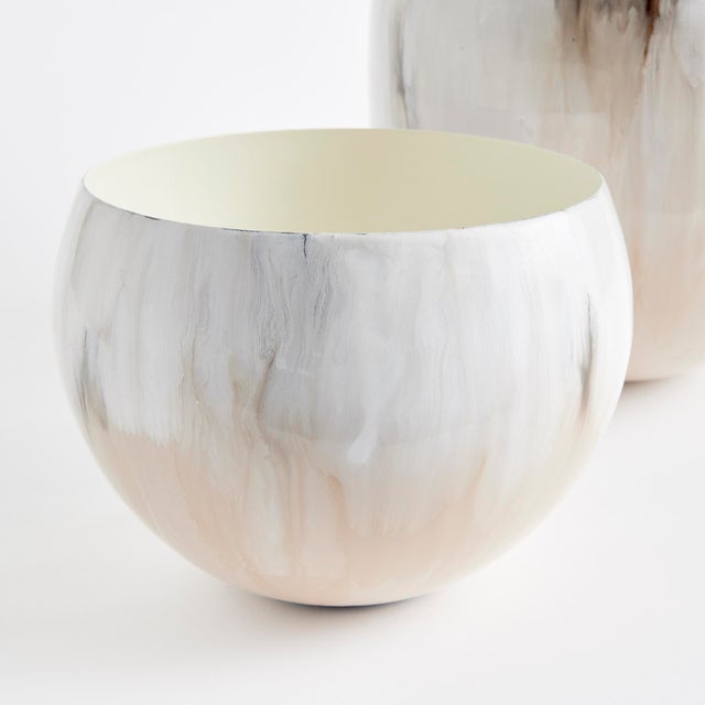 In a clever use of enameled iron, these lightweight cachepots are painted by hand. With aCreamy mocha palette inspired by...