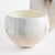 In a clever use of enameled iron, these lightweight cachepots are painted by hand. With aCreamy mocha palette inspired by...