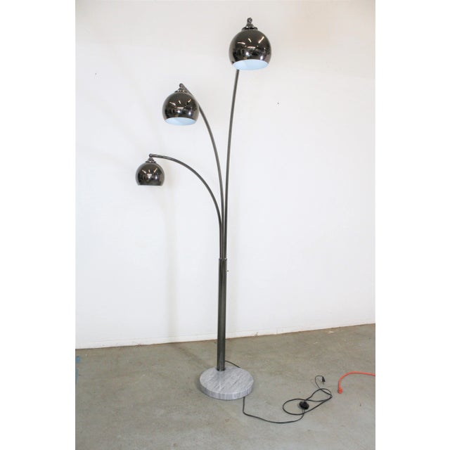 Offered is a super unique, vintage Italian chrome and marble floor lamp. Features a marble base with 3 arc-shaped chrome...