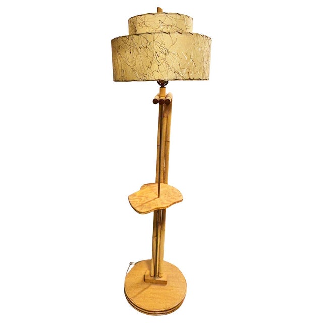 Rare 1950s Googie asymmetric pole floor lamp with a dramatic, swooping rattan and mahogany frame, the lamp features a...