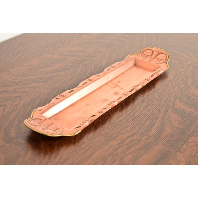 A gorgeous Arts & Crafts period copper and brass tray In the manner of Liberty & Co. England, Early 20th Century Measures:...