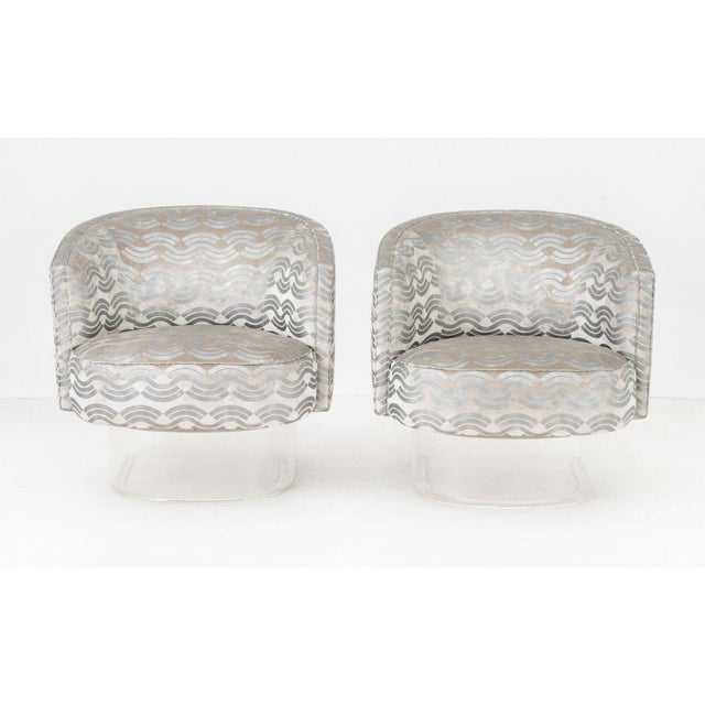Pair of Modern Gray Velvet and Metallic Finish Upholstered Swivel Tub Chairs, on clear acrylic bases. 29.25" H x 29.25" W...