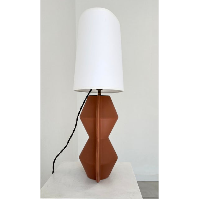 “Africanist” table lamp in enamelled terracotta, France circa 1990 European Plug (up to 250V).The wiring of this item may...