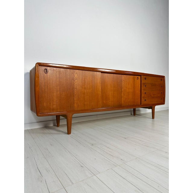 Beautiful large danish sideboard from the 1960s, designed and produced by h.p. Hansen. Made of warm teak wood with clean,...