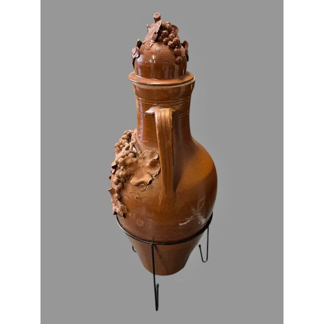 Antique Italian Terra Cotta Covered Urn Vase Grape Vine Relief 2 Handle Decorative Jar with Metal Base Description:...