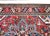 A beautiful early 20th century Persian Heriz rug with a traditional large central floral medallion living amidst a field...