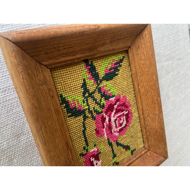 Add a touch of vintage charm to your space with this hand-stitched needlepoint artwork featuring a classic rose motif in...
