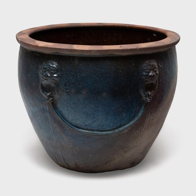 This grand terracotta fish pond is cloaked in a beautiful, blue glaze with tonal variation from dark cobalt to pale grey...