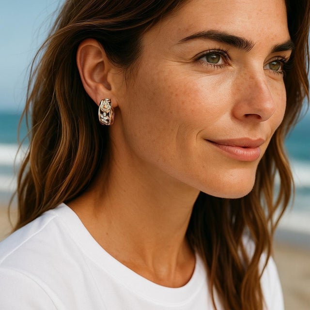 A Captivating Fusion of Color and Timeless Style Enhance your collection with these vintage Simon G. huggie hoop earrings,...