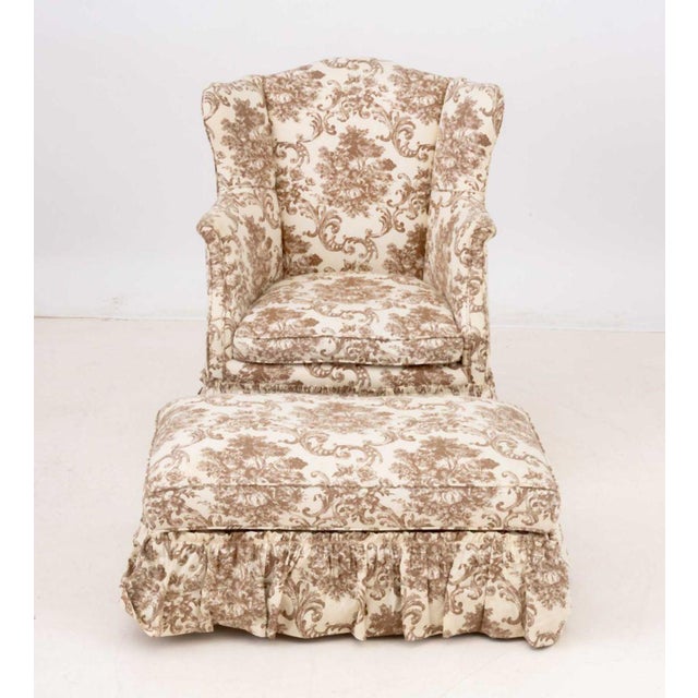 Figural Landscape Print Linen Upholstered Wingback Armchair and Ottoman. 35" H x 25" W x 20" D; seat: 16" H. Provenance:...