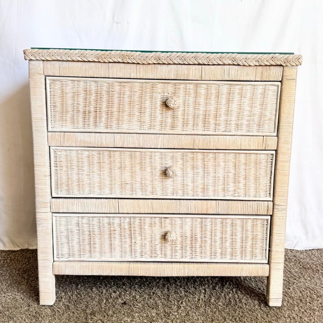 This charming coastal chest features finely woven wicker in a soft white-washed finish, offering a light and breezy Boho...