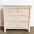 This charming coastal chest features finely woven wicker in a soft white-washed finish, offering a light and breezy Boho...