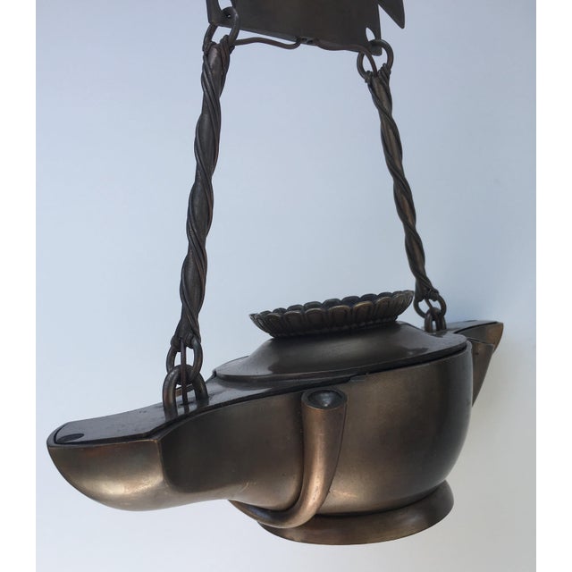 Bronze "Aladdin" Genie Style Ceiling Light. Solid cast brass patina. There are 2 available. Signature unknown. Wired for...