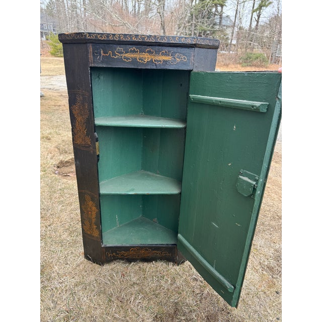 Stunning 18th Century Asian corner cabinet in original paint. Carved birds, hand painted figures, flora and fauna. Brass...