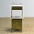 Elegant bedside table from circa 1900, crafted in a refined combination of brass and marble. This piece of furniture...
