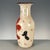 Add a touch of traditional Chinese charm to your space with this elegant double-handled porcelain vase. The vase features...