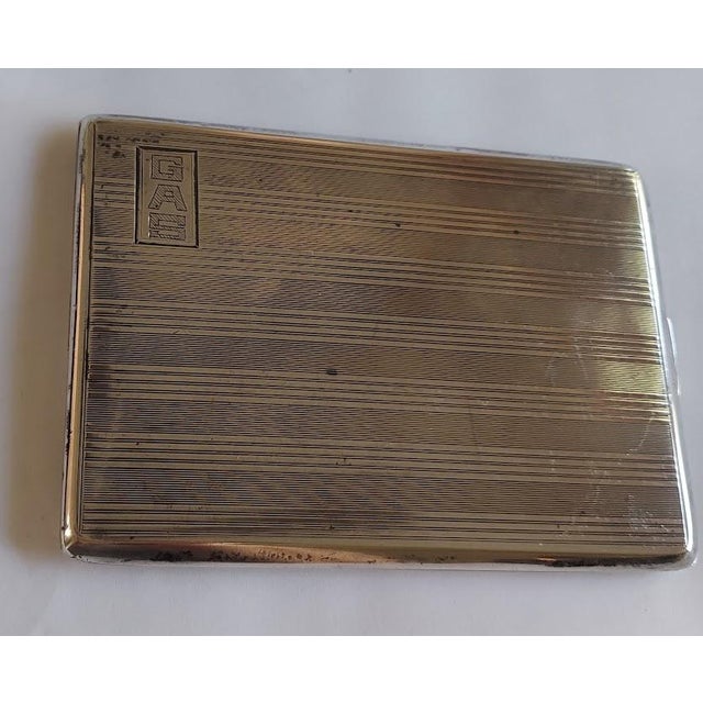 American sterling silver cigarette case by R. Blackinton & Col, with an engine-turned striped exterior and gilt-washed...
