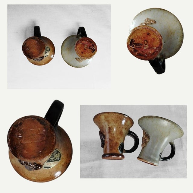 These two curious coffee cups are a true rarity within the work of Roger Guérin, the renowned Belgian ceramist of the Art...