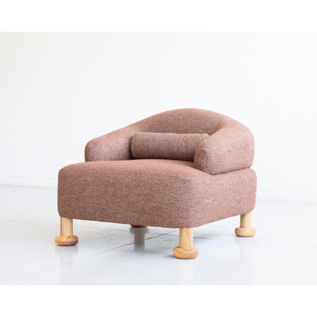 Caubeen club chair with bolster pillow by BDDW – Built entirely from scratch and upholstered by hand. Legs carved from...