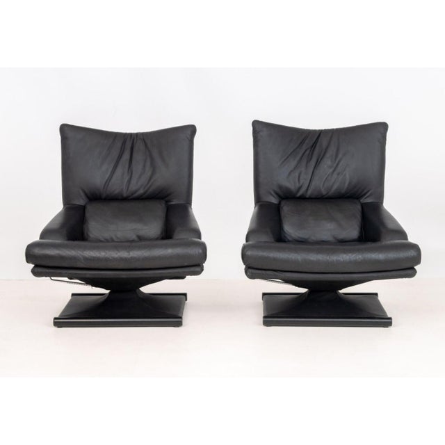 Pair of Mathias Hoffmann for Rolf Benz Model 6500 Swivel Lounge Chairs, in black leather on square bases. 40" H x 35" W x...