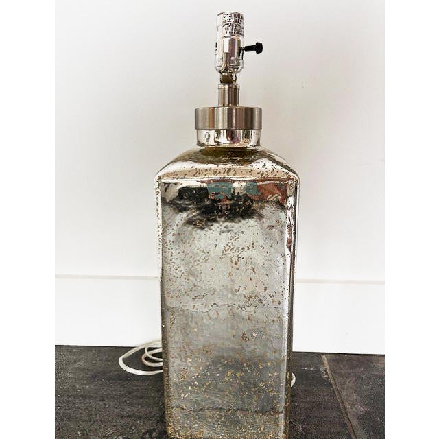 A gorgeous square mercury glass table lamp. This unique piece is sure to stand out in anyone's home. The piece is in good...