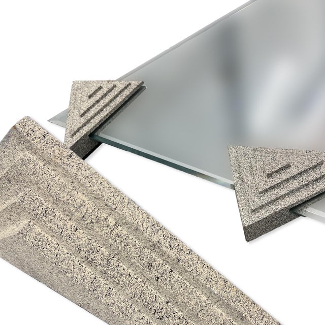 Striking postmodern mirror featuring a bold triangular form with sculptural geometric accents. This piece blends...