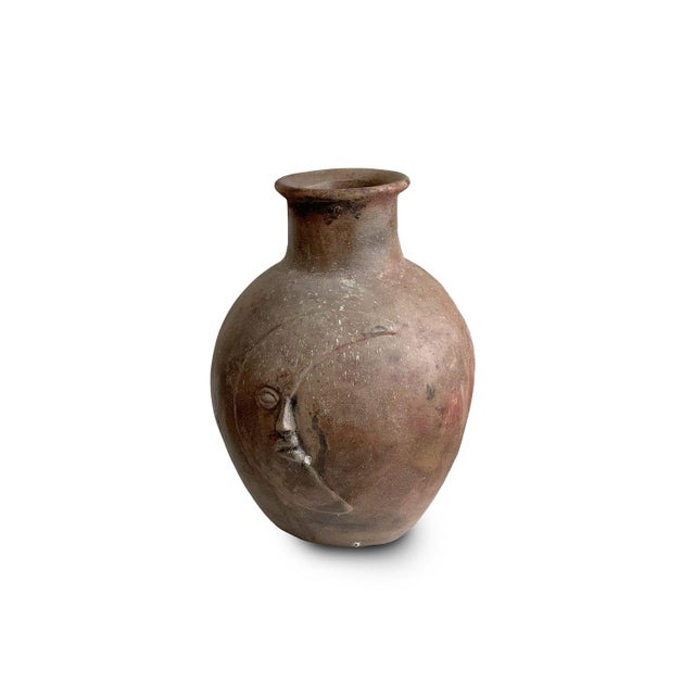 Discover the whimsy of this two-side ceramic vase, featuring the sun and moon motifs. Enjoy two looks in one with its...