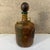 For your consideration, a vintage leather wrapped bottle decanter Hollywood Regency. Italy Circa the 1960s. Dimensions:...
