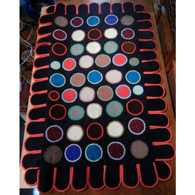 This graphic Folk Art table-top or wall-hanging penny rug-style quilt in Pop Art colors and design, is hand-sewn and...