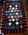 This graphic Folk Art table-top or wall-hanging penny rug-style quilt in Pop Art colors and design, is hand-sewn and...