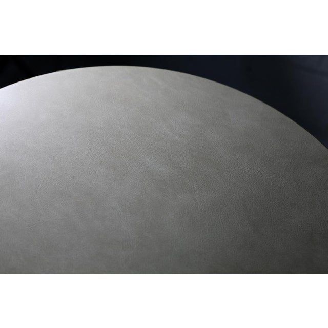 Tubular steel side table, round wooden strap. France, Circa 1950. Solid and stable, traces and bites on feet. Small...