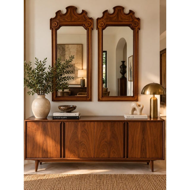Elegant pair of vintage 1970s wall mirrors by Thomasville, featuring beautifully crafted walnut wood frames with warm,...