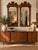 Elegant pair of vintage 1970s wall mirrors by Thomasville, featuring beautifully crafted walnut wood frames with warm,...
