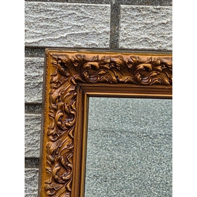 The 1940 gilded Hollywood wall mirror is an antique piece with a rectangular shape and a gold color frame finish. This...