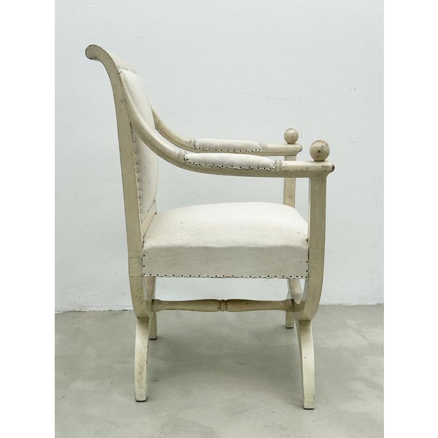 Two of a total of 4 Bergères in white, exposed, preserved original condition. Directoire /Empire France (?) around...