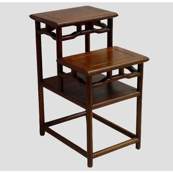 Constructed the traditional Chinese joinery technique, this accent table with two shelves and openwork around creates...