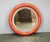 Striking Italian illuminated round wall mirror dating from the 1970s, designed with the bold sculptural character...
