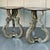 This is a pair of Italian neoclassical style side tables by Palladio. The tops are silver gilt wood. The legs are carved...