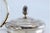 Glass Bottle with Embossed Silver Lid and Pine Cone-Shaped Handle, in Good conditions.