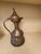 Graceful and sculptural, this antique Turkish hand-hammered copper ewer is a beautiful example of traditional Ottoman...