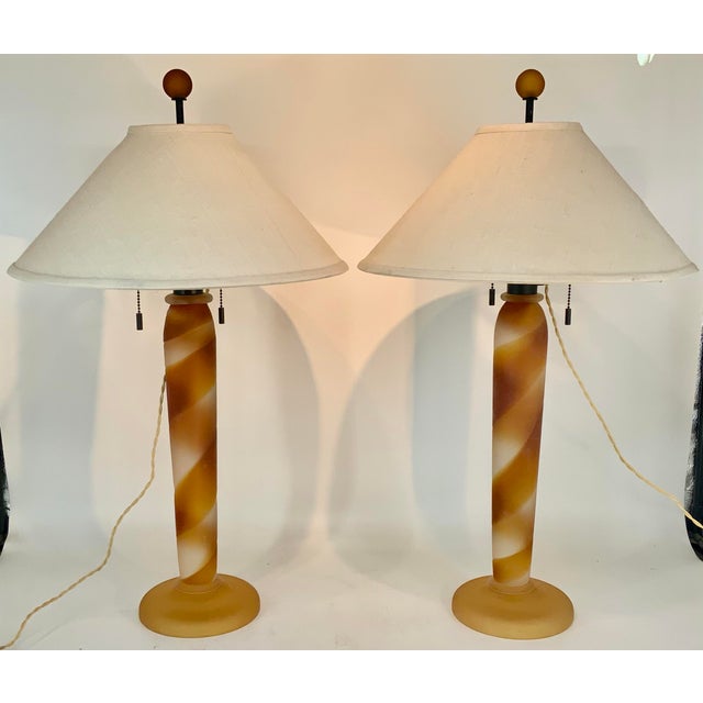 Pair of fabulous table lamps by John Hutton for Donghia. Murano glass with sandblasted surface in a golden amber swirl...