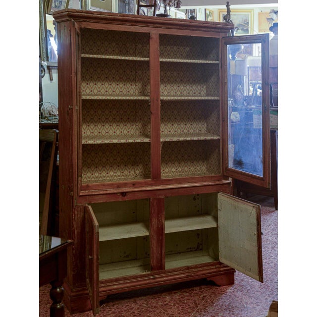 Credaza showcase pantry bookshop with 4 doors in solid fir wood with grooved frames, Italy era 1800. Measures 135 x 40 x h...