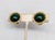 1950s round goldtone cabochon faux-dark green jade clip earrings. Marked "Carnegie" in script on the clips. Measure: 7/8...