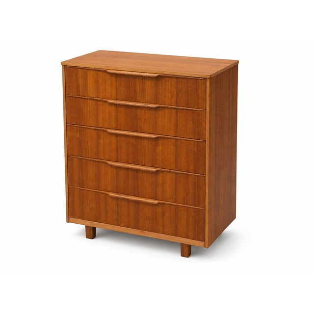 A handsome mid-century teak five-drawer chest of drawers, attributed to Austinsuite, with the clean proportions and...