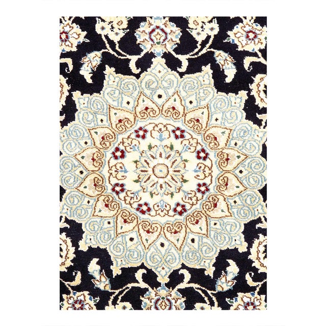 A hand-knotted, the rug that features gorgeous wool and silk and an ornate, tan and dark blue -ish field. D08134