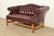 A gorgeous vintage camelback Chesterfield sofa or loveseat In the manner of Hancock and Moore By Classic Leather, Inc....