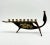This striking mid-century brass menorah features a sculptural boat silhouette with elegant Damascene-style etching on both...