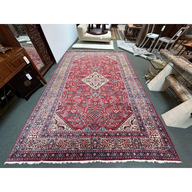 Design Plus Gallery presents an 8ft 2in × 11ft 10in Josheghan Hand Knotted Iranian Jewel Tone Rug. The rug offers a...