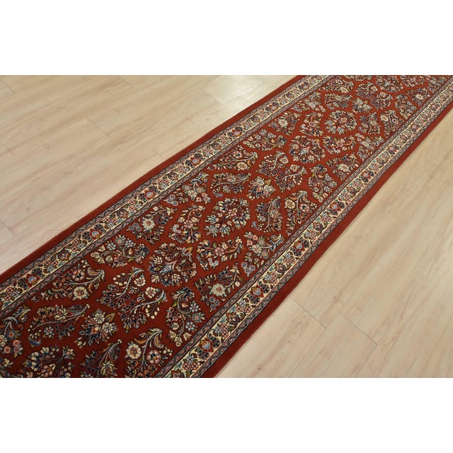 An authentic vintage traditional Sarouk runner hand-knotted with fine wool and natural dyes. This beautiful, intricately...