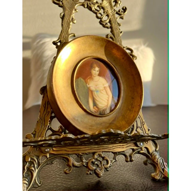Beautiful antique/vintage oval miniature, original, hand-painted, signed, and gilded wall decor of a young, pretty lady in...
